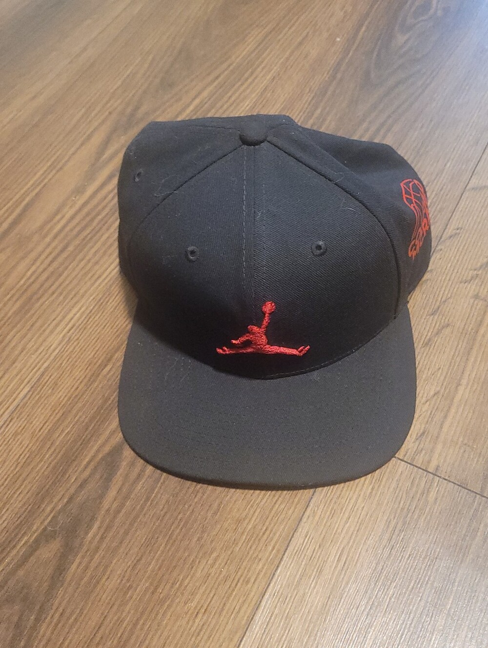 Jordan Black Snapback Hat with Red Jumpman Logo